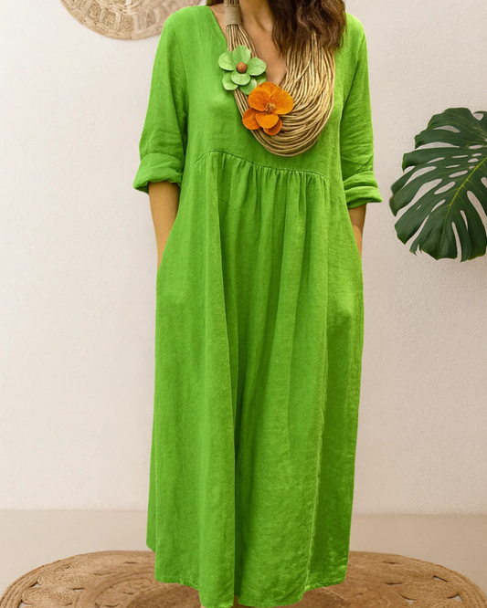 Vestido longo de linho com gola redonda e bolsos