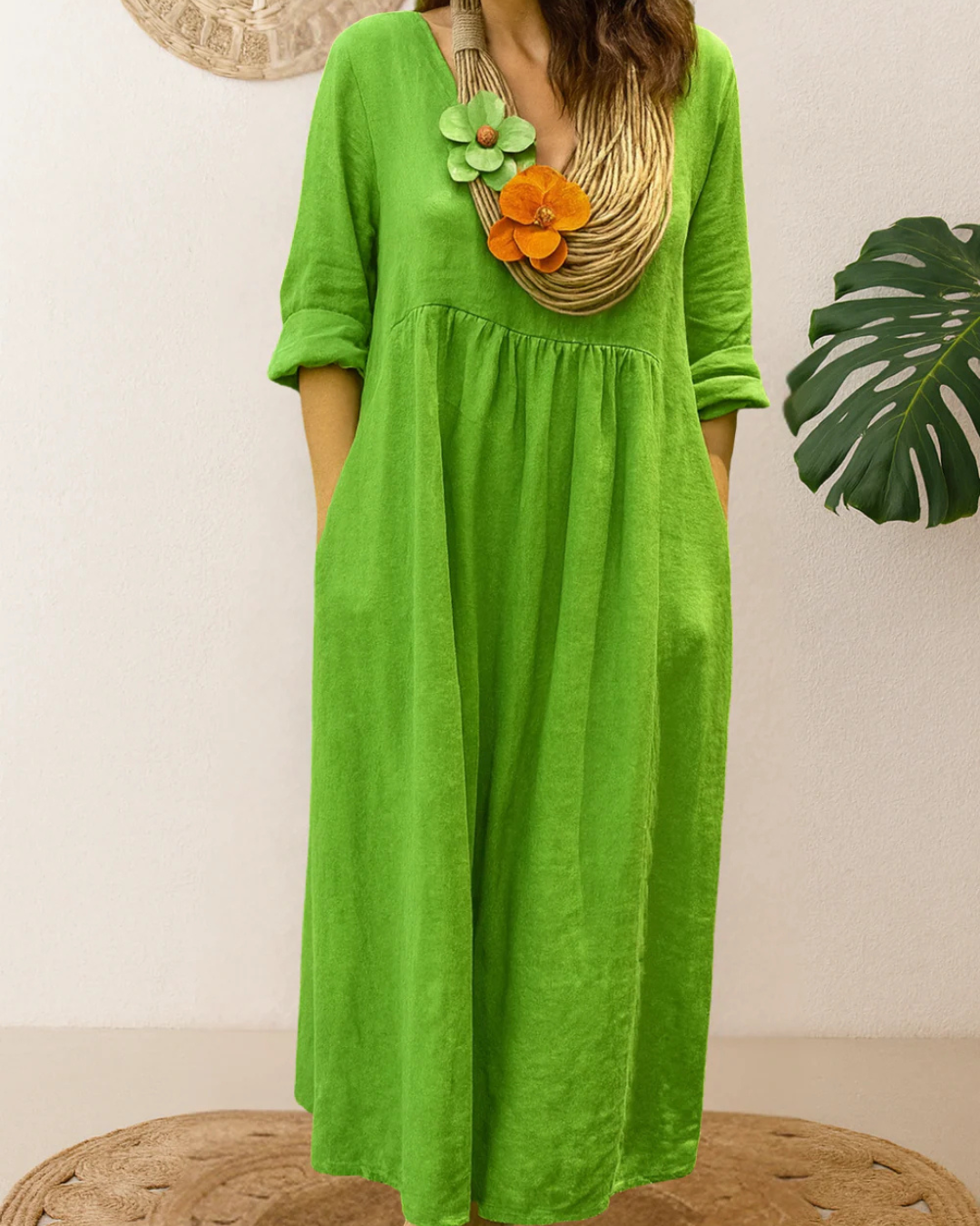 Vestido longo de linho com gola redonda e bolsos