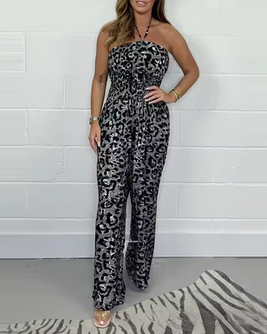 Macacão estampado sem alças com decote haltere e pernas largas