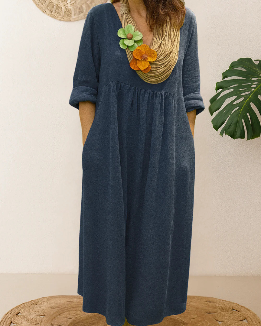 Vestido longo de linho com gola redonda e bolsos