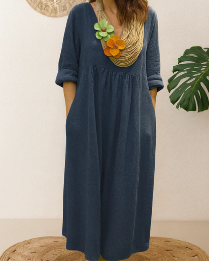 Vestido longo de linho com gola redonda e bolsos